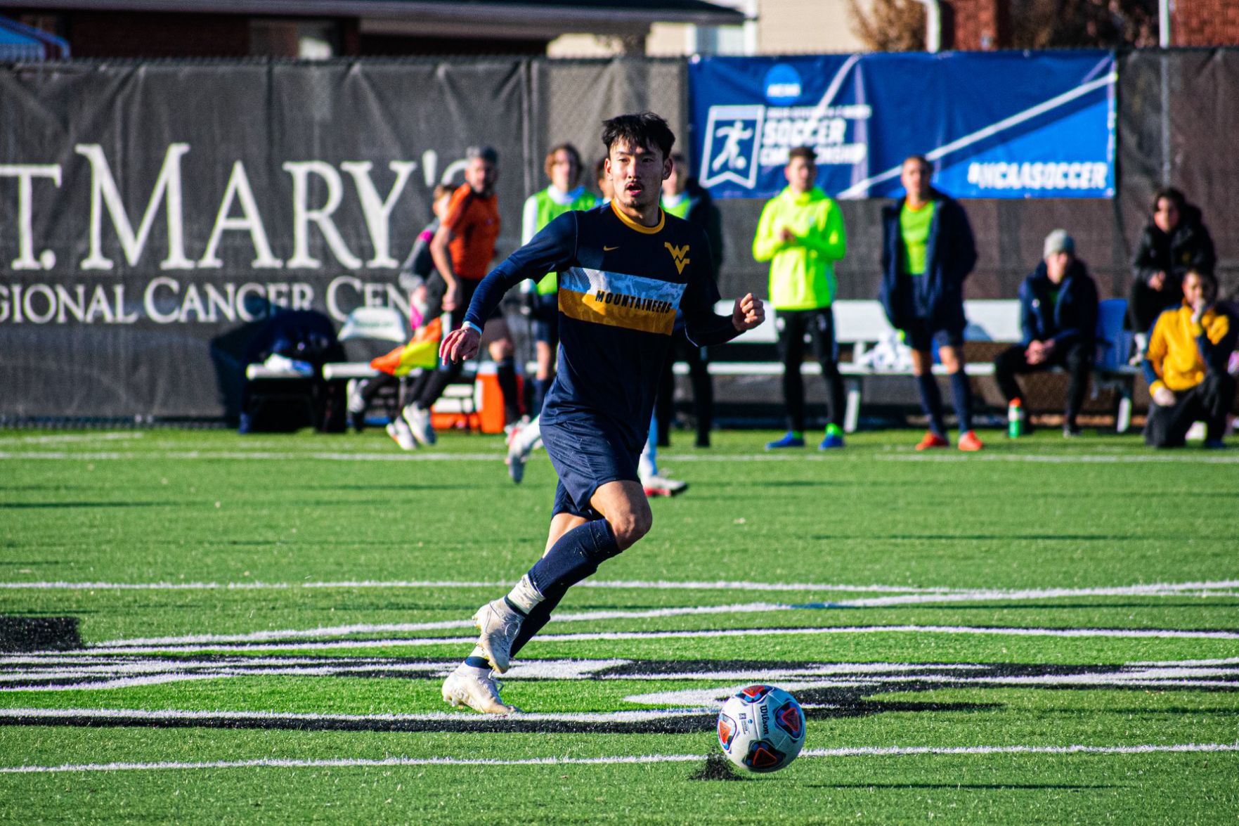 West Virginia forward Tsubasa Takada drives with the ball against Marshall on Nov. 24, 2019.
